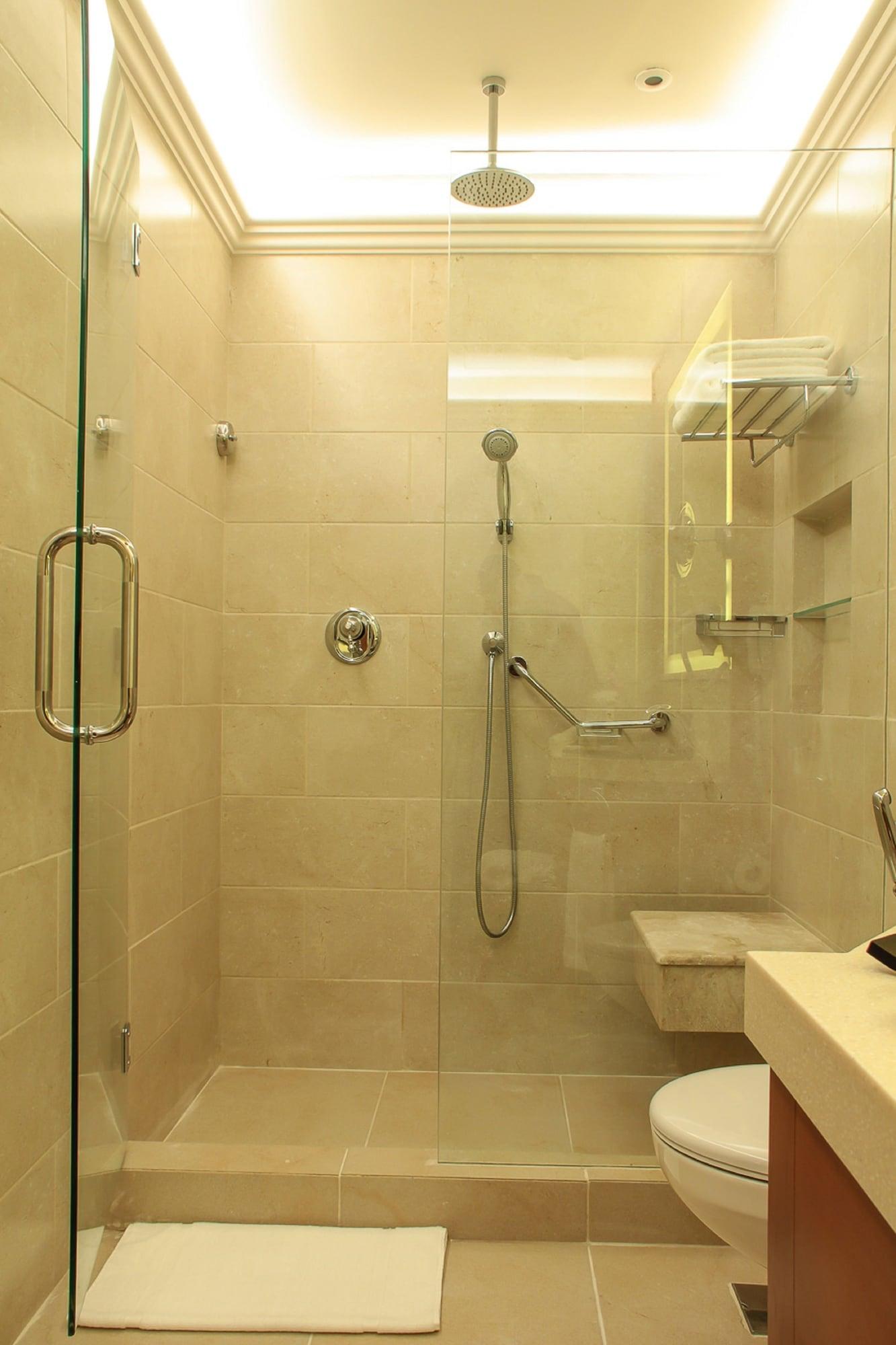 Thousand Nights Hotel Amman Exterior photo A shower with a shower head and handheld shower head