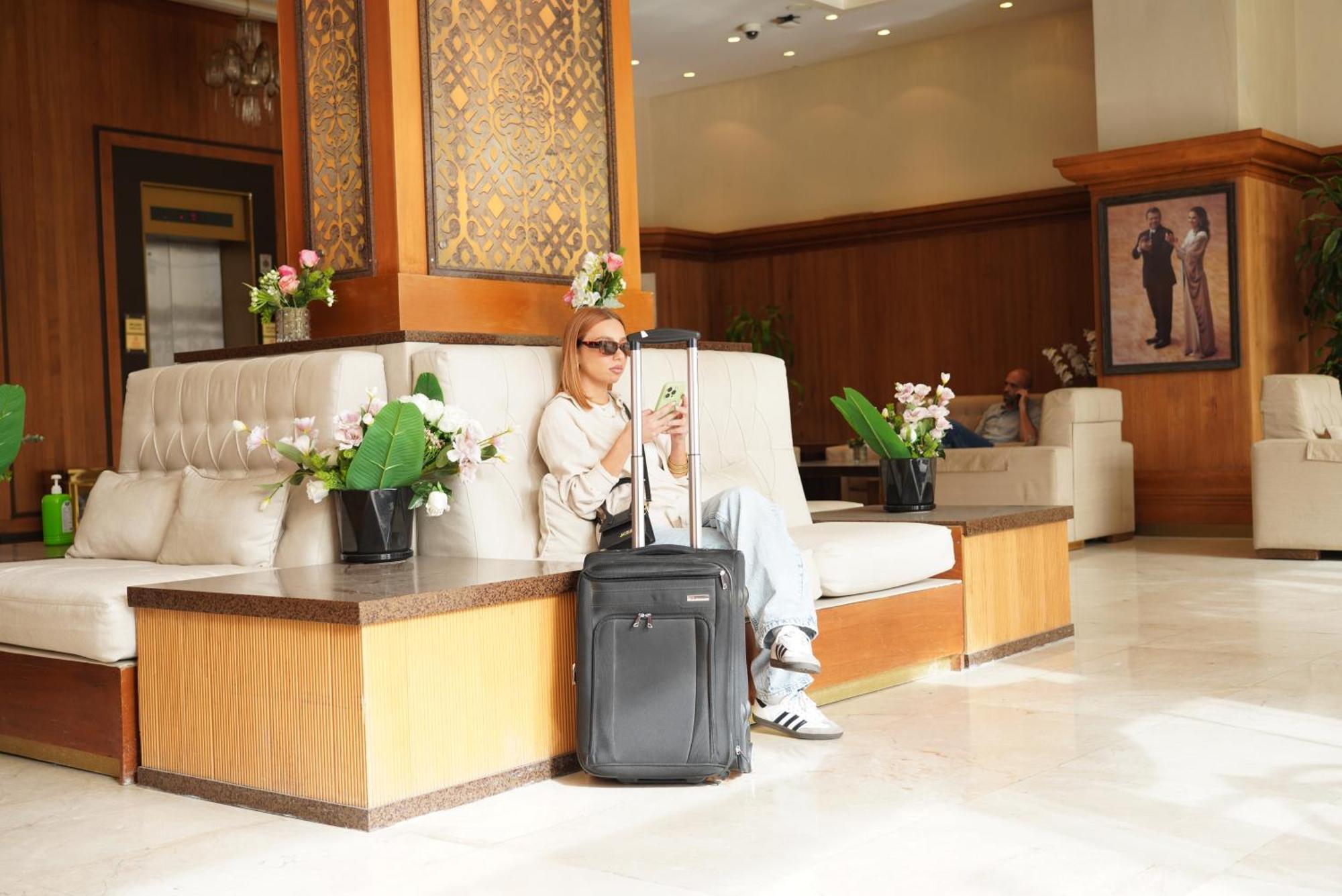 Thousand Nights Hotel Amman Exterior photo A woman with a suitcase