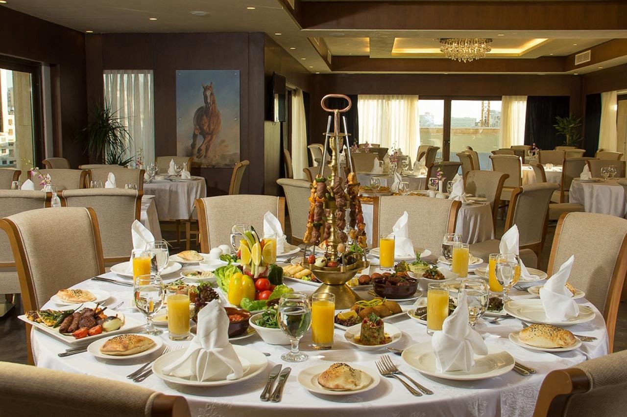 Thousand Nights Hotel Amman Exterior photo A table set for a meal